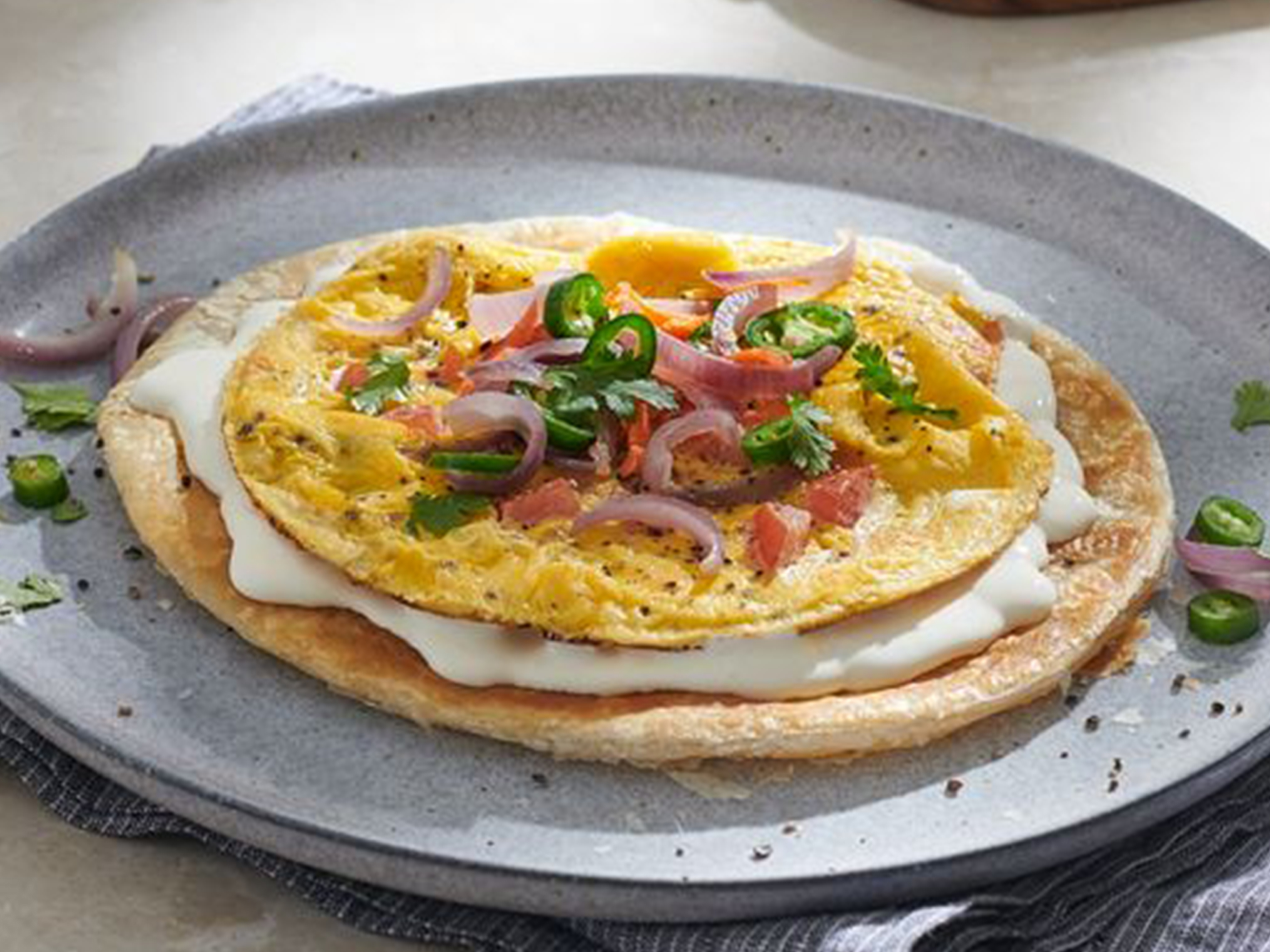 Paratha with cream cheese and vegetables omelette