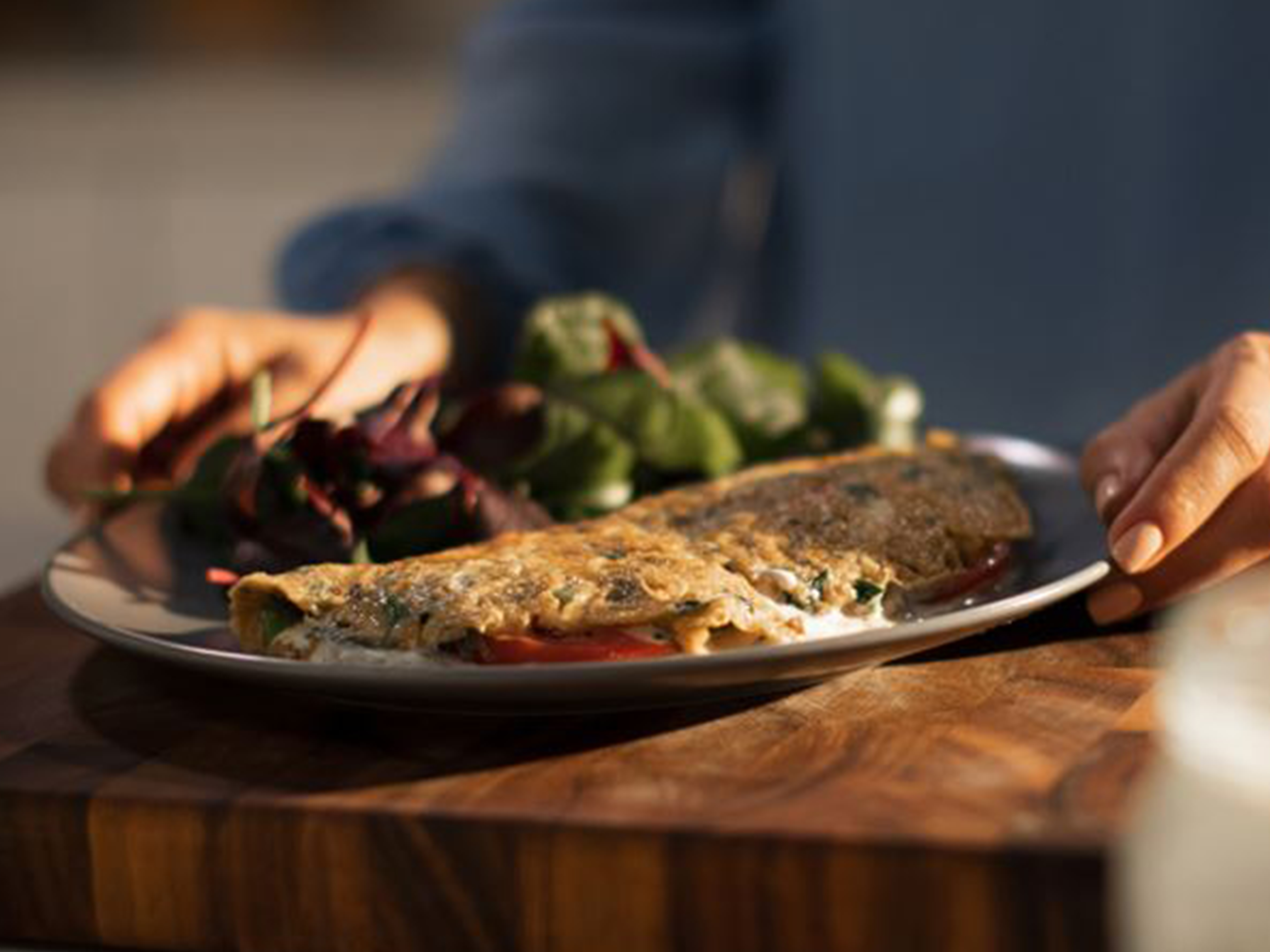 Fresh Herb Omelette with Tomato Slices and Cream Cheese Spread
