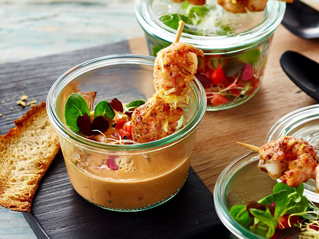 Seafood Soup with shrimp skewers