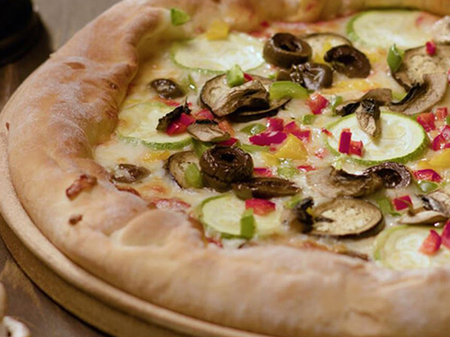 Vegetarian pizza with Puck Shredded Mozzarella & Kashkaval Cheese Mix