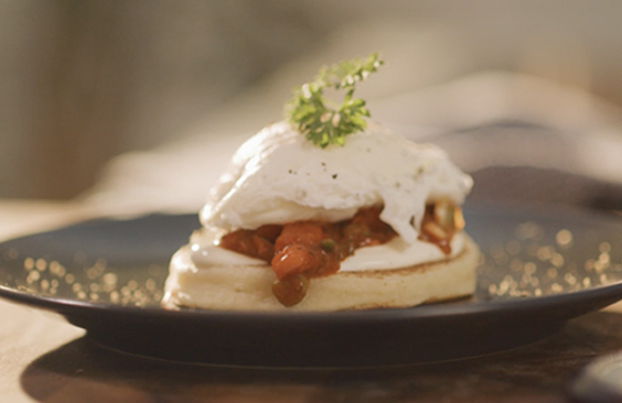 Moroccan Harcha with Poached Eggs, Spicy Tomato Sauce and Cream Cheese Spread