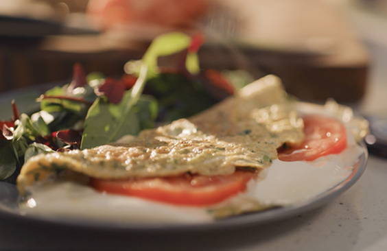Fresh Herb Omelette with Tomato Slices and Cream Cheese Spread