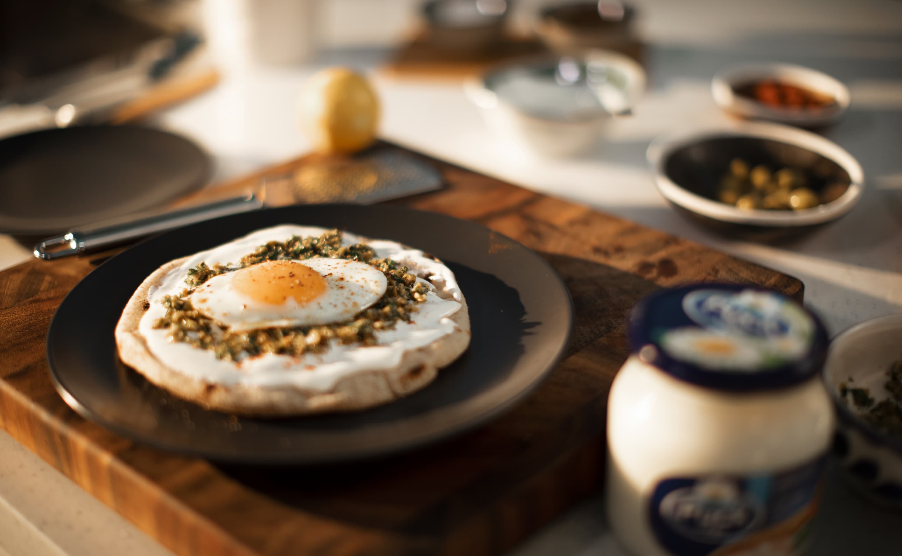 Fried Egg on Pita Bread with Green Olive Paste and Cream Cheese Spread