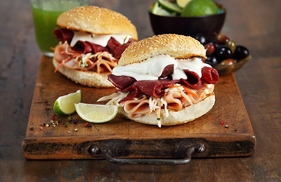 Burgers with cheese, cold cuts meat and coleslaw